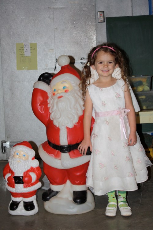 Maeve kept us well entertained while we packed boxes.  She and Santa got married and they are posing with their son Chimney.