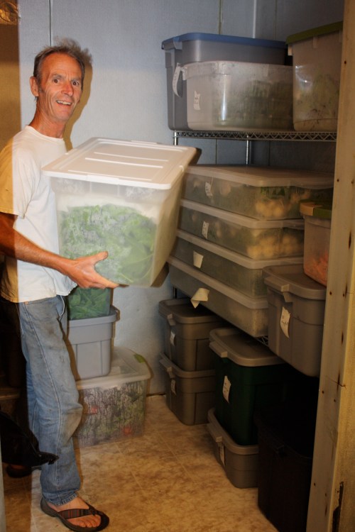 Scott with all the produce in the cooler washed weighed and ready to be portioned out.