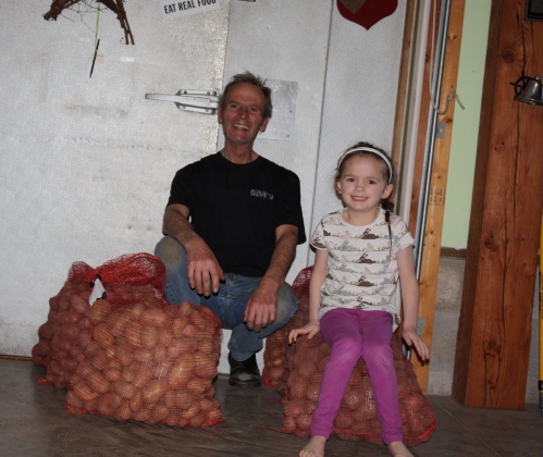 Scott and Maeve with 300 pounds of seed potatoes.