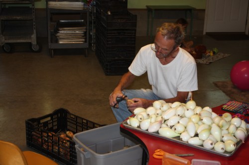 Scott cleaning this week's onion harvest.